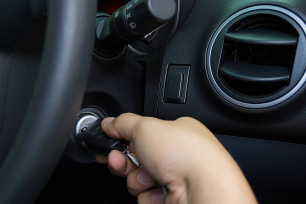 Man Starting The Car With Key. Ignition Repair by Automotive Locksmith Service in Pflugerville TX