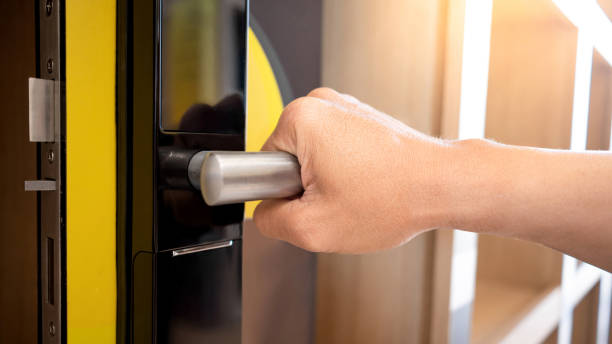 Office Door Locksmith Austin Tx Hand of an Office Staff Smoothly open the Door after 512 Commercial Locksmith in Austin TX Repair the Door Lock